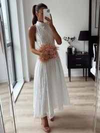 woman-wearing-sleeveless-hollow-out-white-belt-long-dress