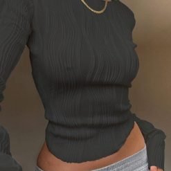 woman-wearing-ruched-long-sleeve-crop-top