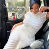 woman-wearing-knitted-shorts-sleeve-striped-see-through-dress