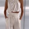 woman-wearing-silk-pleated-sleeveless-top-and-pants-set