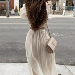 woman-wearing-folds-flare-sleeve-loose-dress